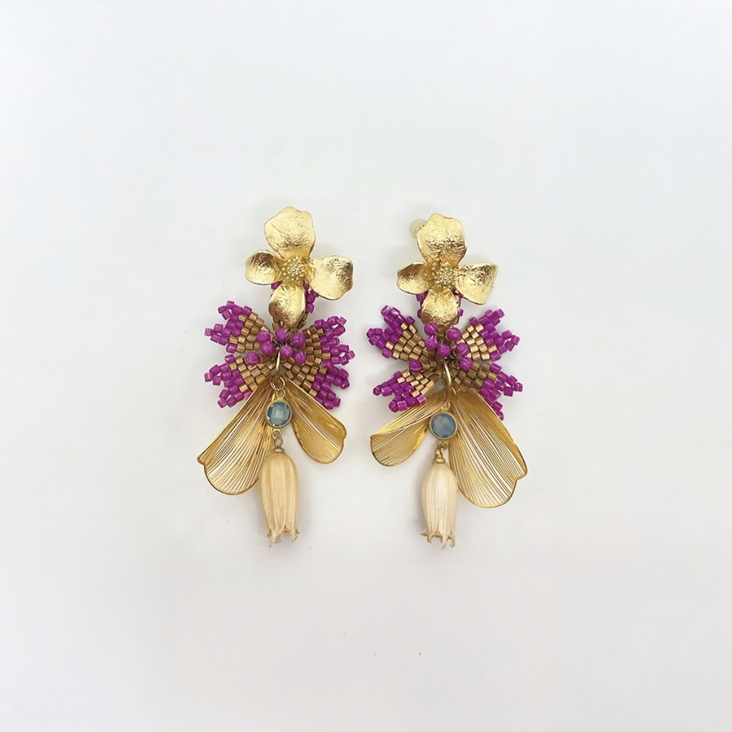 Earrings in gold leaf, woven beads, steel, opal, and preserved flower | Nuna Qori